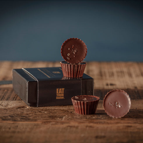 Bourbon Barrel Foods Bourbon Smoked Sea Salt Caramels 4 Piece Chocolate Gift Box | Chocolate on top of box.